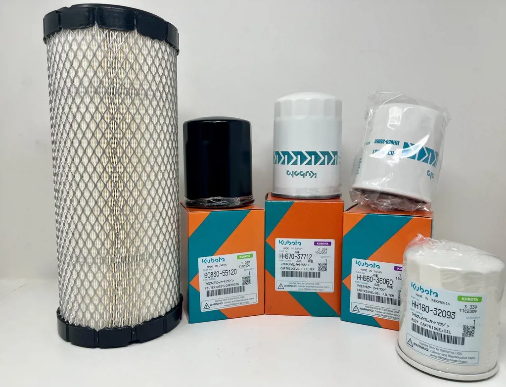 Genuine Kubota parts including air filters, oil filters, and hydraulic filters with original packaging