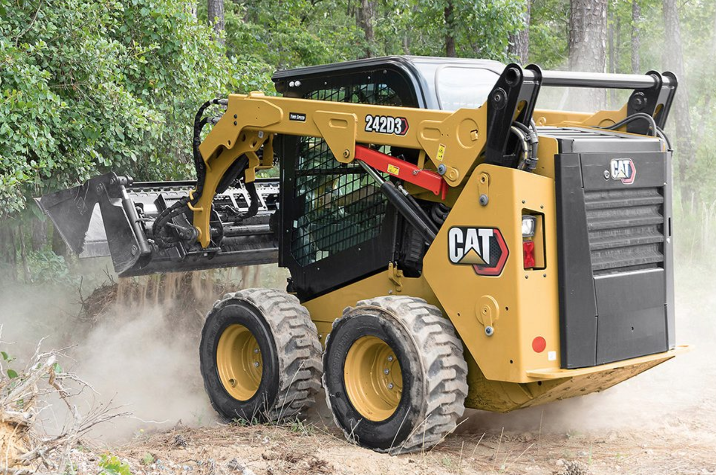 Caterpillar skid steer loader in action showing equipment capabilities for construction and agricultural work